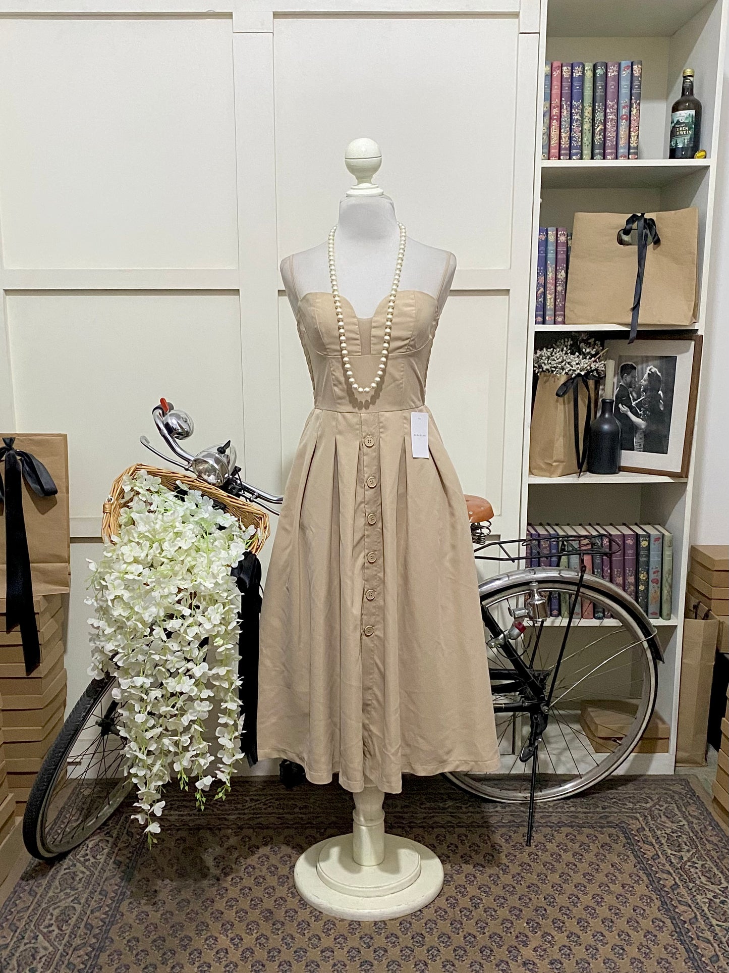 Saray, vestido midi línea A albaricoque tirantes